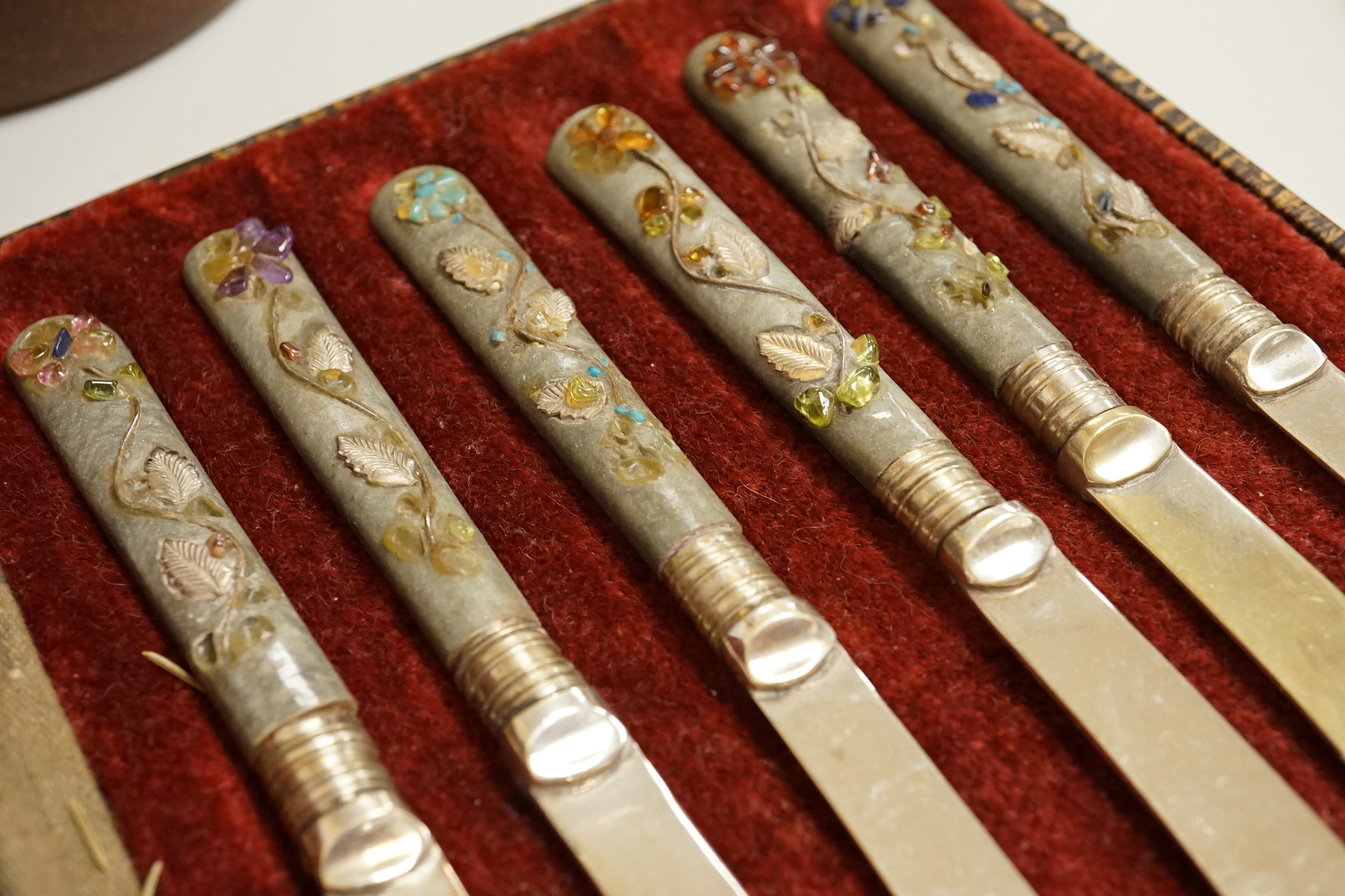 A cased set of semi-precious handled butter knives, two Chinese pottery teapots, a stoneware box and a figure, etc.
